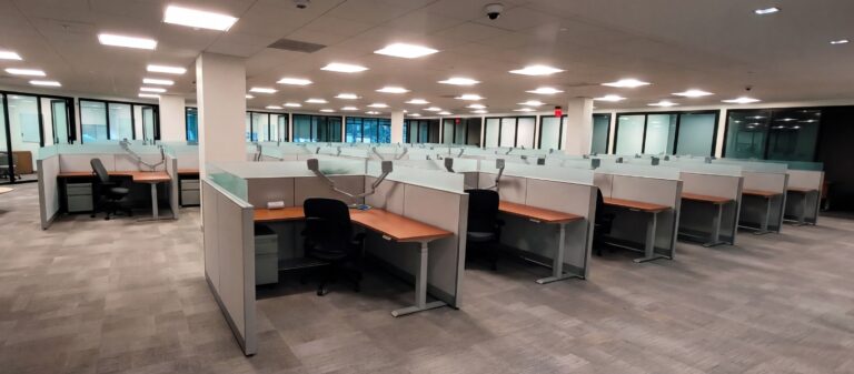 Workstation pod built on remanufactured Steelcase Answer panel systems with new glass stackers, work surfaces, and sit-to-stand bases